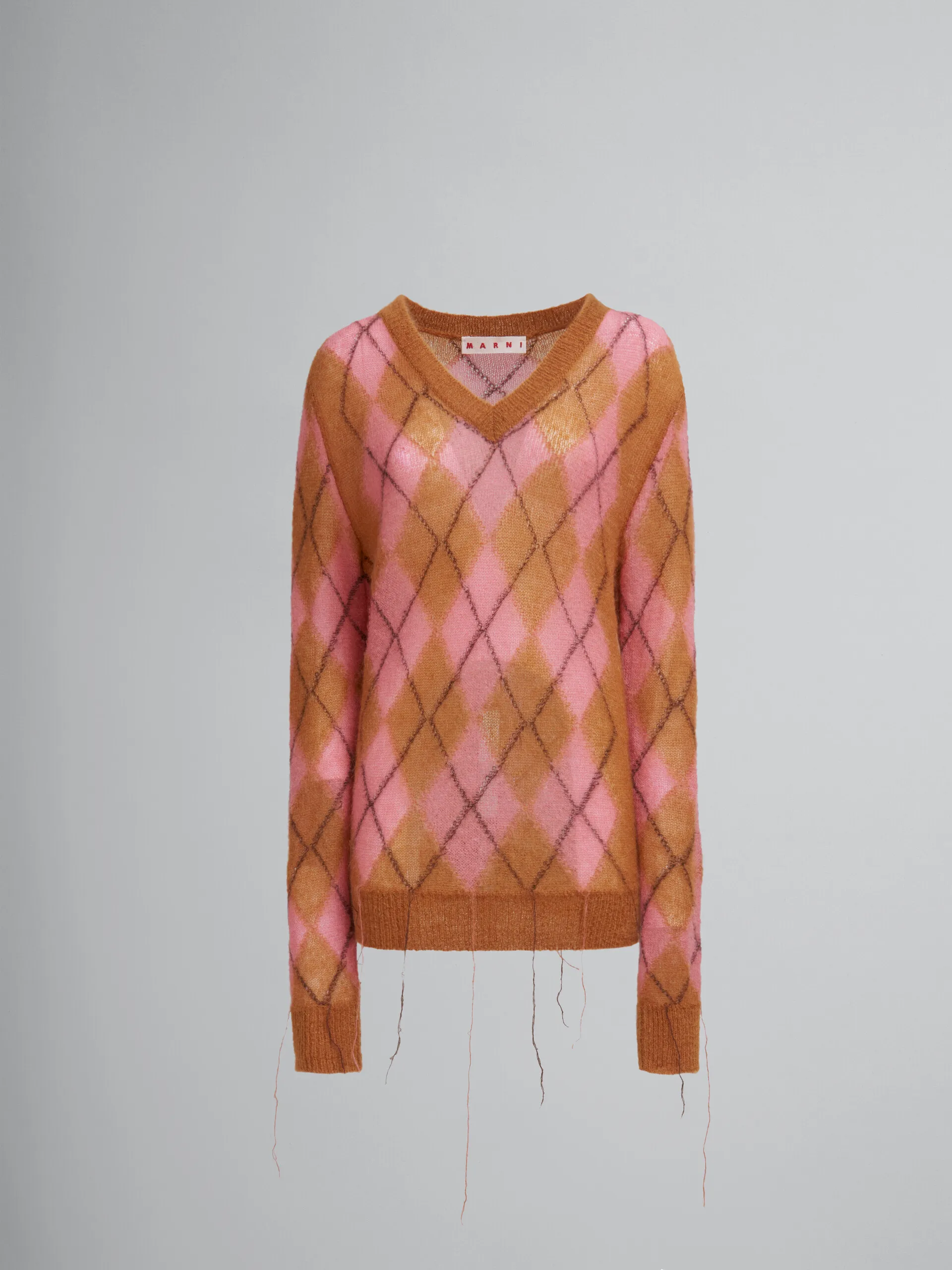 Jersey naranja de mohair con rombos e hilos flotantes